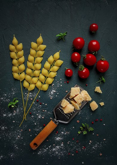 Food concept, pasta, with cherry and parmesan cheese, top view, no people, wheat, pasta spikelets