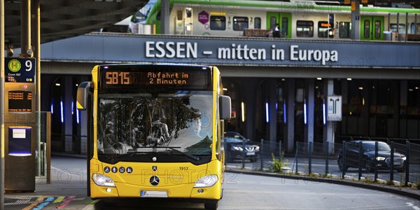 Essener Verkehrsbetriebe bus at the main railway station with local train, public transport,
