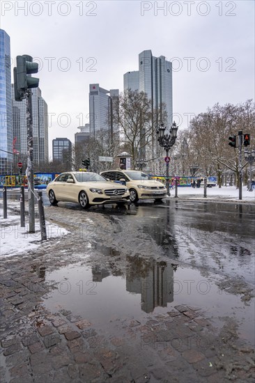Puddle, winter in the city, Deutsche Bank building, Sparkasse, Trianon Frankfurt building,