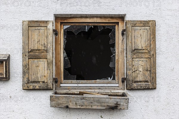 Window of a farmhouse destroyed by hail, storm on 26.8.23 near Benediktbeuern, Bavaria, Germany,