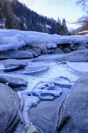 Inn or En near Scuol in winter, with ice floes, Engadin, Grisons, Switzerland, Europe