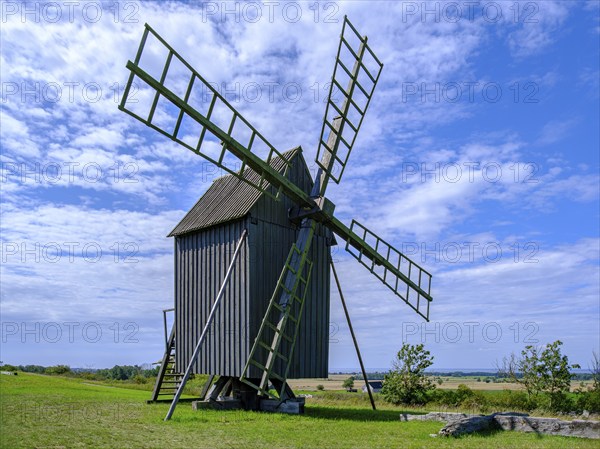 Three traditional historic windmills (Resmo väderkvarnar) in the village of Resmo on Öland, Kalmar