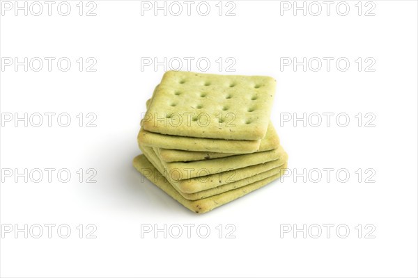 Green cracker pile isolated on white background. side view, close up