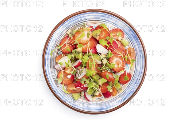 Vegetarian fruits and vegetables salad of strawberry, kiwi, tomatoes, microgreen sprouts isolated