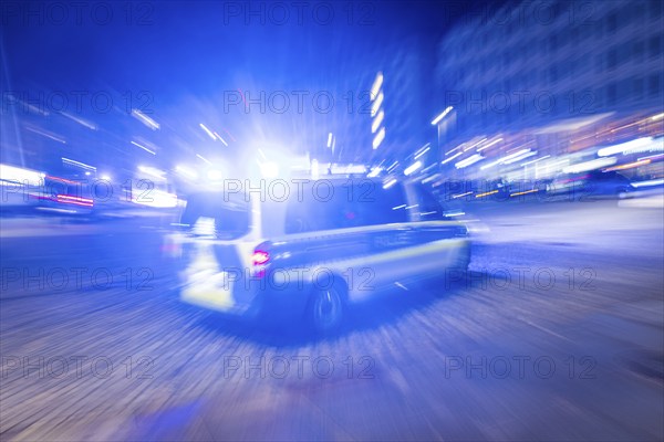 A police vehicle in action, with blue light switched on, Dresden, Saxony, Germany, Europe