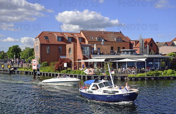 Europe, Germany, Mecklenburg-Western Pomerania, island town of Malchow, Lake Malchow, at the swing
