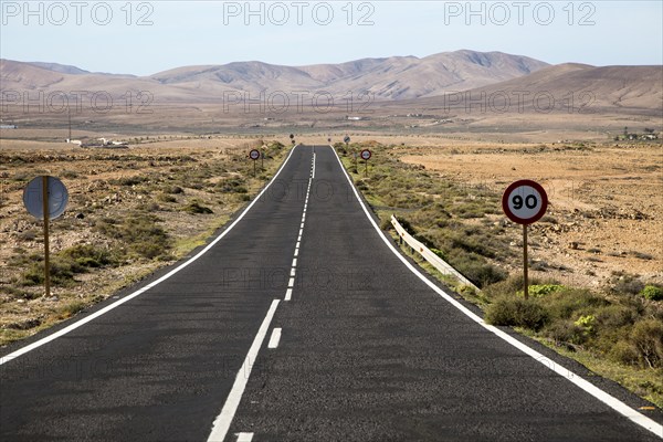 Straight tarmac road crossing desert, Fuerteventura, Canary Islands, Spain, Europe