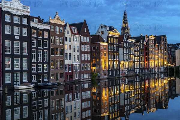 Canal houses on the Damrak, in the centre of the old town of Amsterdam, harbour, starting point of