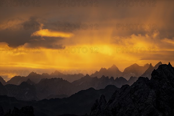Montafon mountains with dramatic cloudy sky at sunrise, Tschagguns, Rätikon, Montafon, Vorarlberg,