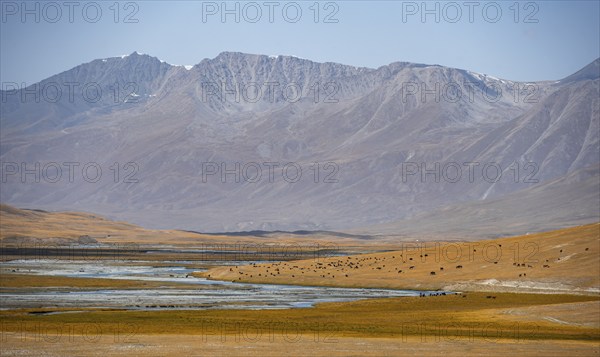 Burkhan mountain valley with river, barren dramatic mountain landscape, Terskey Ala-Too, Tien Shan,