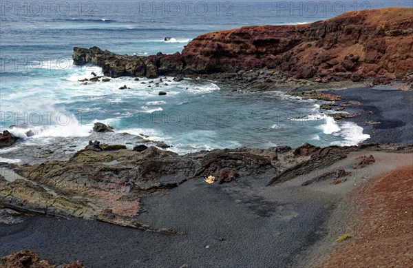 Lava rocks at the Playa de los Ciclos near the Green Lake, Lago Verde, El Golfo, Lanzarote, Canary