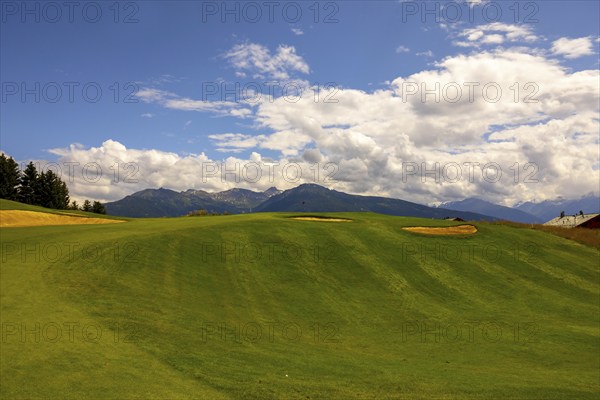 Crans Sur Sierre Golf Course with Hole 7 and Mountain View in Crans Montana in Valais, Switzerland,