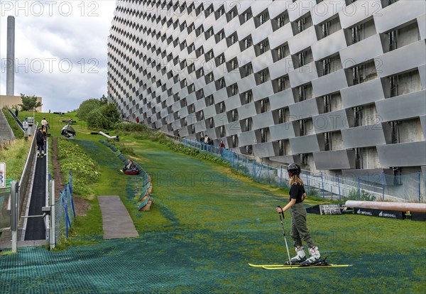 CopenHill, waste incineration plant and artificial ski slope, skiing with a view of the ski lift,