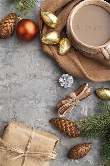 Christmas or New Year composition. Decorations, cones, cinnamon, fir and spruce branches, cup of