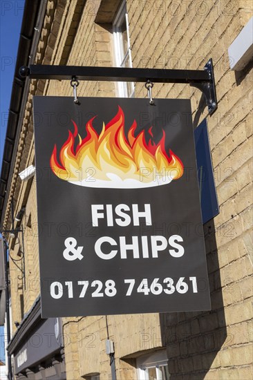 Fish and Chips sign sign outside chip shop, Wickham Market, Suffolk, England, UK