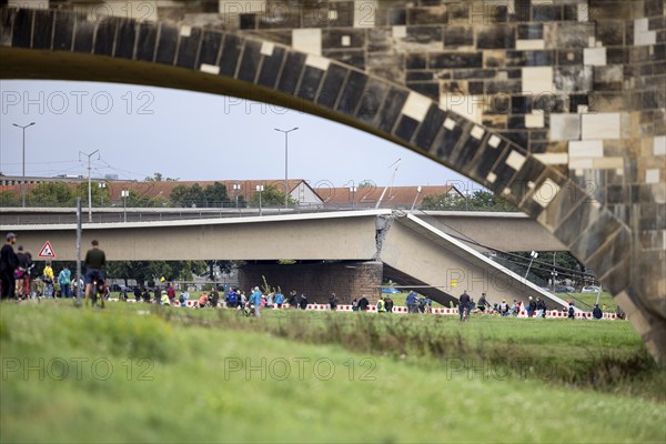 Partially collapsed Carola Bridge, seen through the Augustus Bridge in Dresden, 11/09/2024