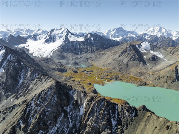 Mountain panorama, aerial view, 4000 metre peak with glacier, mountain pass and mountain lake
