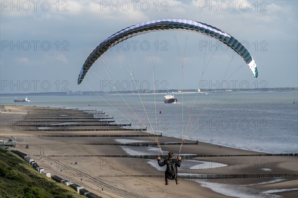 Paragliders along the dunes of Zoutelande, in Zeeland, South Holland, Netherlands