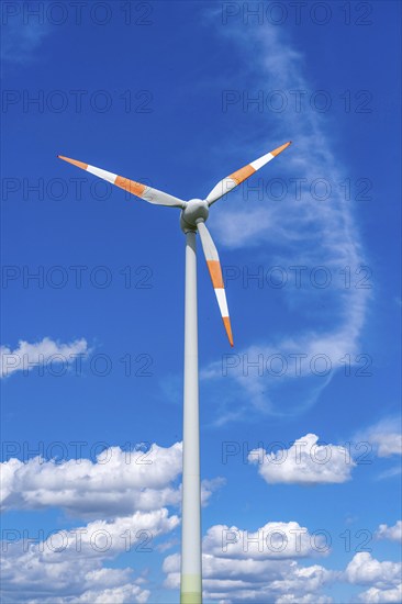 Wind turbine, wind energy plant from the manufacturer Enercon, blue sky with many white clouds,