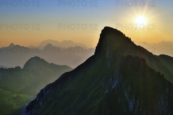 Tierberg at sunrise, behind it the Appenzell Alps with Alpstein and Säntis, cantons of Glarus and