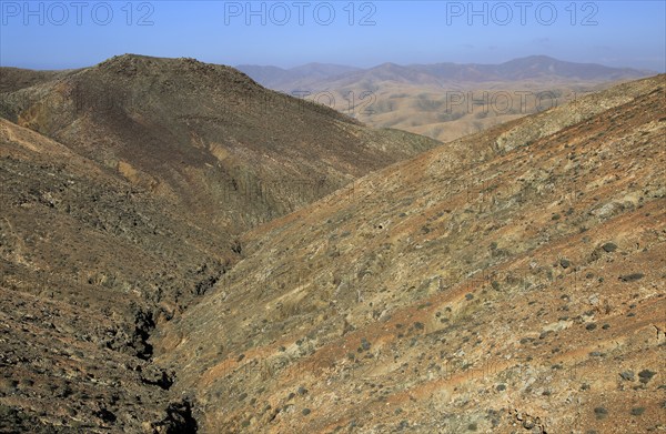 Bare moon-like arid landscape in mountains between Pajara and La Pared, Fuerteventura, Canary