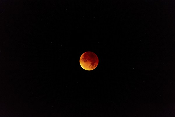 The moon with starry sky, blood moon, taken in the Swiss mountains, Switzerland, Europe