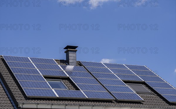 Solar system on the pitched roof of a residential building, photovoltaics for power generation, for