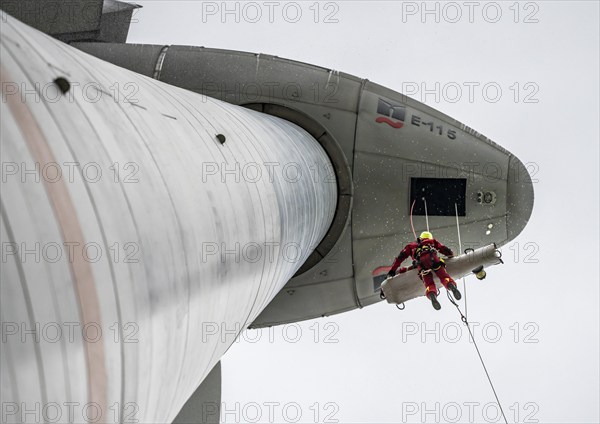 Height rescuers from the Oberhausen professional fire brigade practise abseiling from a wind