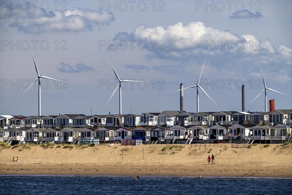 Wind turbines, wind farm, holiday homes, beach houses on the beach of Ijmuiden in North Holland,