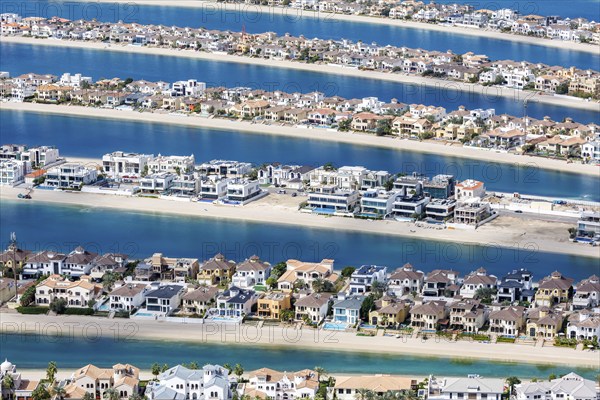 Artificial island in the shape of a palm tree The Palm Jumeirah with luxury villas properties in