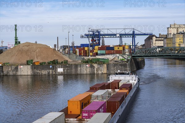 Container freighter Aarburg, leaving the container terminal in Frankfurt Osthafen, belonging to