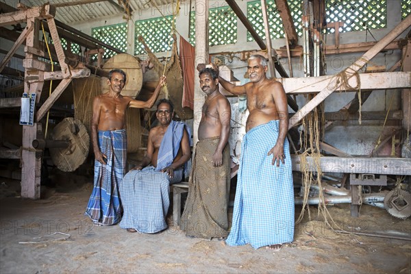 Indian worker in the weaving mill of the Labourers Coir Mats and Mattings Cooperation, coir mat