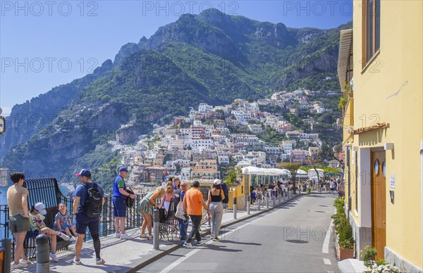 Footpath to the centre with panorama of the town on the steep slopes above the sea, Positano,