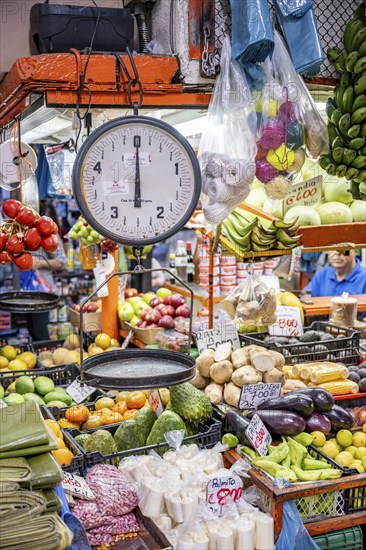 Scales and display of fruit and vegetables at a market stall, Mercado Central de San José, San