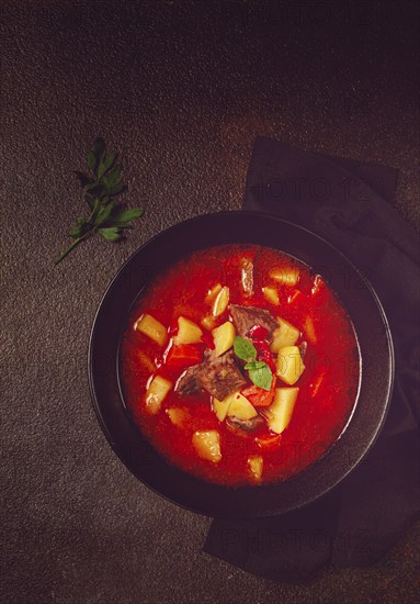 Meat goulash, with potatoes and carrots, sweet pepper, traditional Hungarian soup, homemade, no