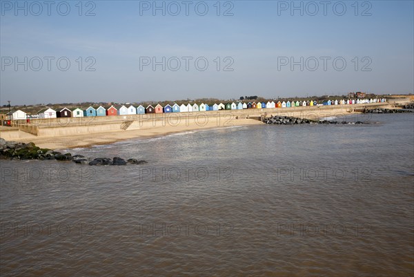 Colourful beach huts line the promenade at Southwold, Suffolk, England, United Kingdom, Europe