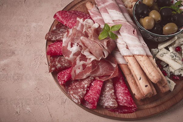 Appetizer, assortment, set, sausage, and cheese, on a wooden board, top view, no people