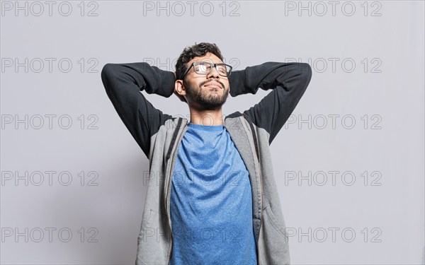 Relaxed person with closed eyes with hands behind his head isolated, Satisfied person with hands