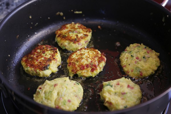 Swabian cuisine, preparation savoy cabbage, wild boar medallions with savoy cabbage cakes, frying