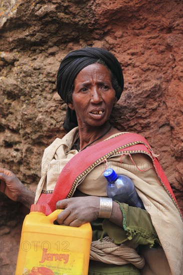 Pilgrim at the rock-hewn churches in Lalibela, container for holy water, Ethiopia, Africa