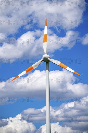 Wind turbine, wind energy plant from the manufacturer Enercon, blue sky with many white clouds,