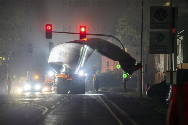 Transport of a 68 metre long, 22 tonne blade of a wind turbine, here in Breckerfeld, with a