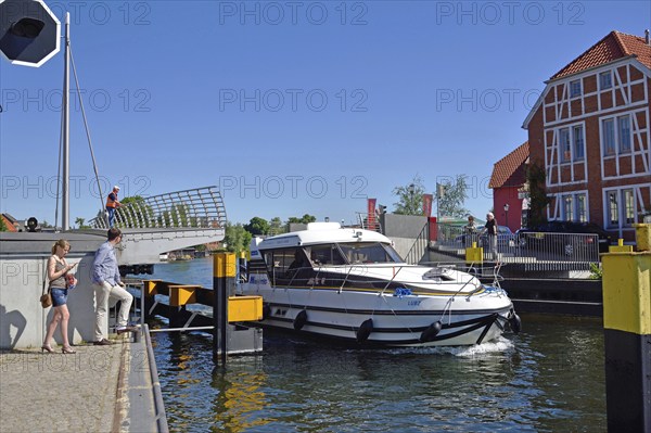 Europe, Germany, Mecklenburg-Western Pomerania, island town of Malchow, Lake Malchow, at the swing