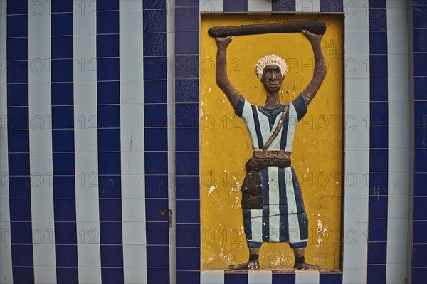 Mural decoration representing a disciple of the Mouride brotherhood Senegal . Mouridism is a muslim