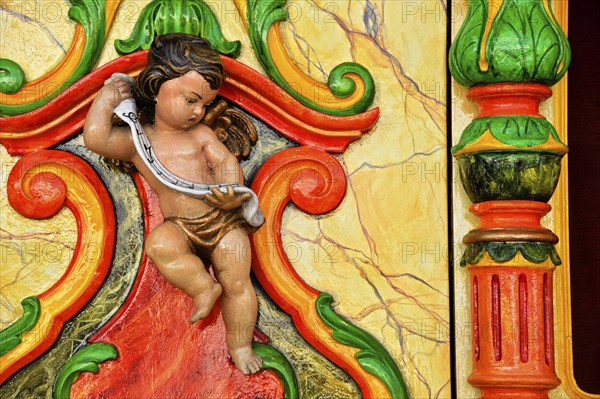 Wooden figure of a cherub at an old carousel organ or fairground organ, historic Wies'n, Oide