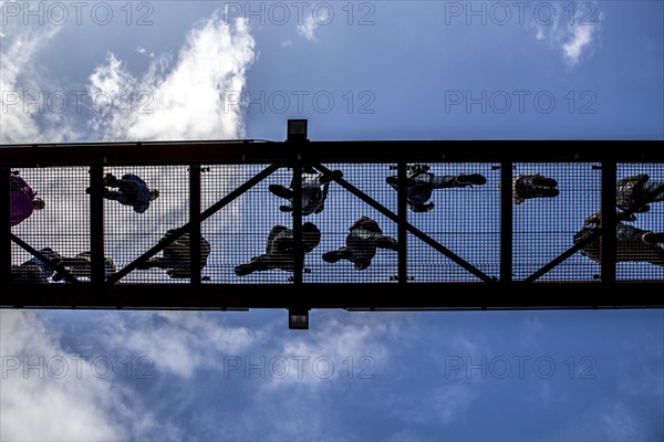 Lattice walkway, people walk over a walkway at a height of a good 15 metres, made of steel lattice,