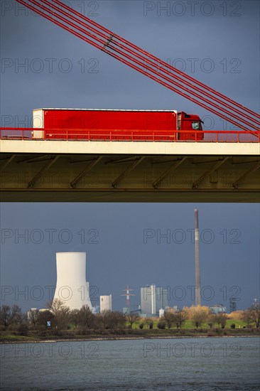 Beeckerwerther Brücke, motorway bridge, A42, truck, cargo ship on the Rhine, behind the STEAG