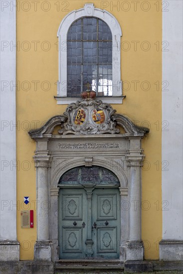 Entrance portal to the monastery church of St Hedwig, 1755, above the alliance coat of arms of the