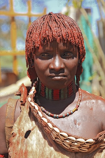Southern Ethiopia, woman of the Hammer people in Dimeka, dress made of goatskin and hair dyed with