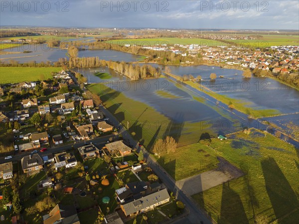 Aerial view of residential area next to lakes due to flooding, under cloudy sky, Christmas, 2023,